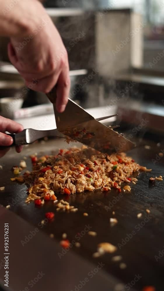 The chef prepares delicious rice dishes in the restaurant.
The chef prepares delicious rice dishes in the restaurant.