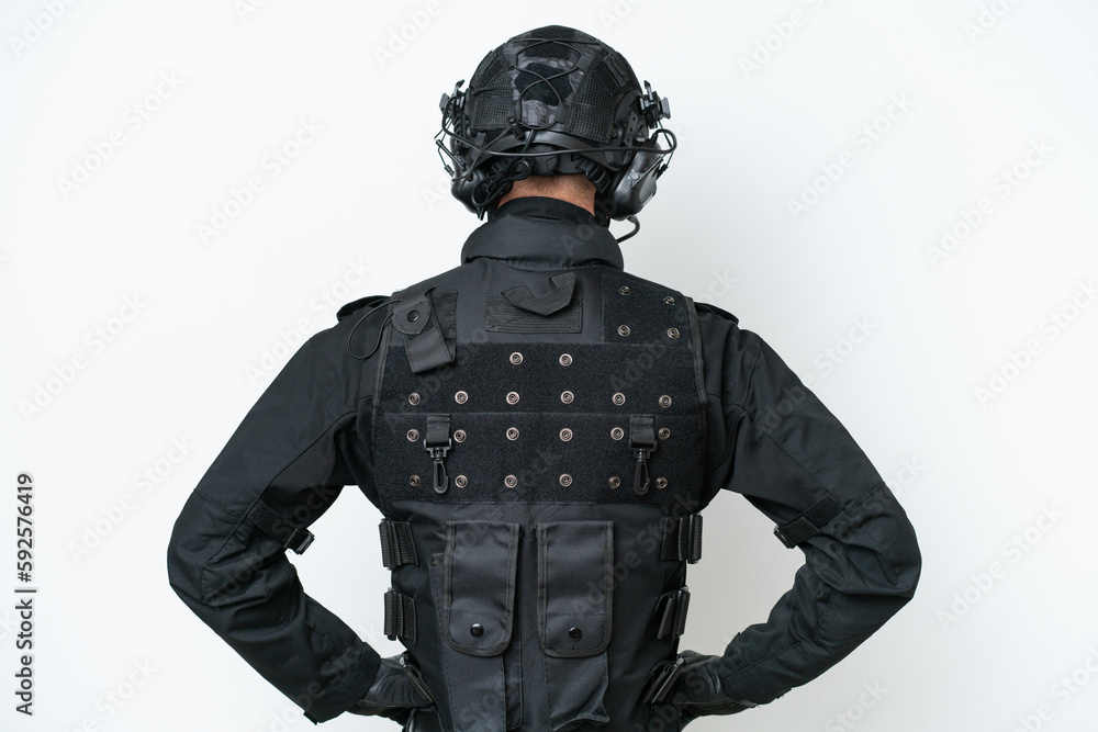 SWAT man over isolated white background in back position SWAT man over isolated white background in back position