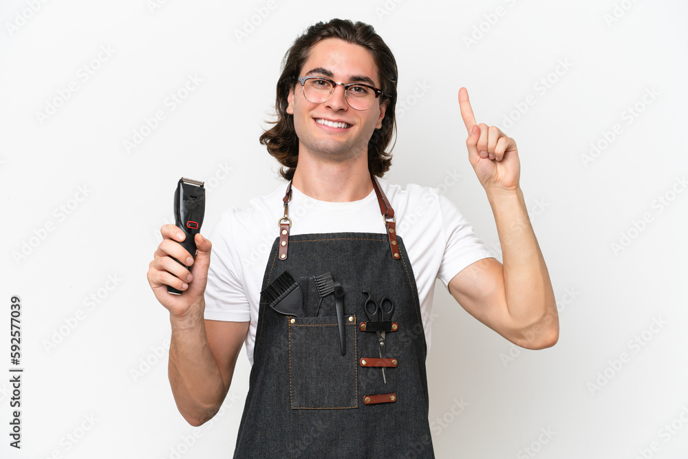 Young hairdresser man isolated on white background pointing up a great idea Young hairdresser man isolated on white background pointing up a great idea