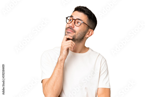 Cuadro en lienzo Young handsome caucasian man over isolated chroma key background and looking up