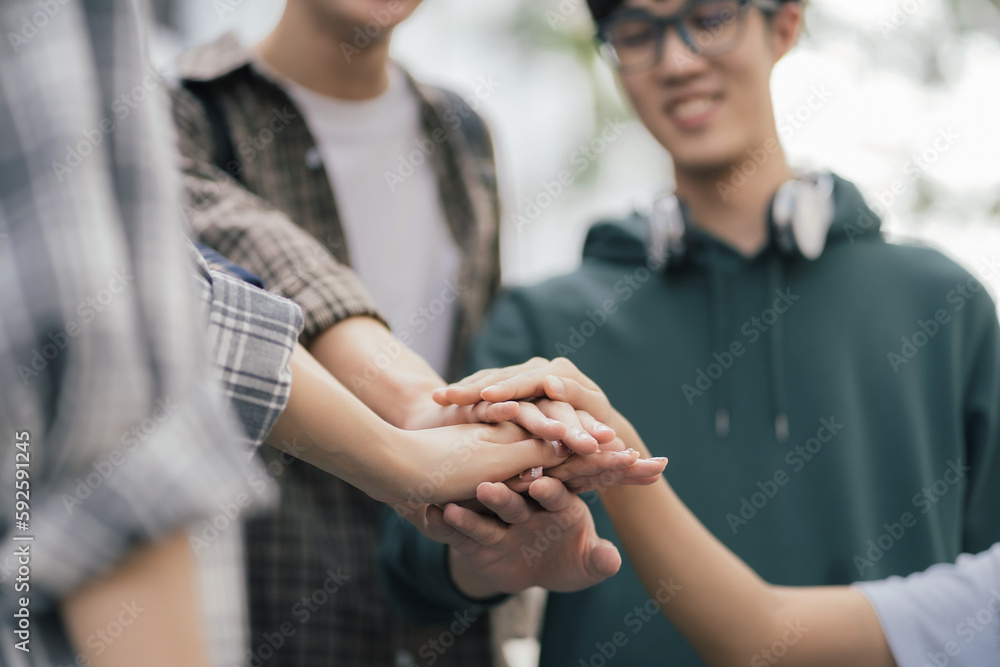 Student shake hands together at University place. team study concept. Student shake hands together at University place. team study concept.
