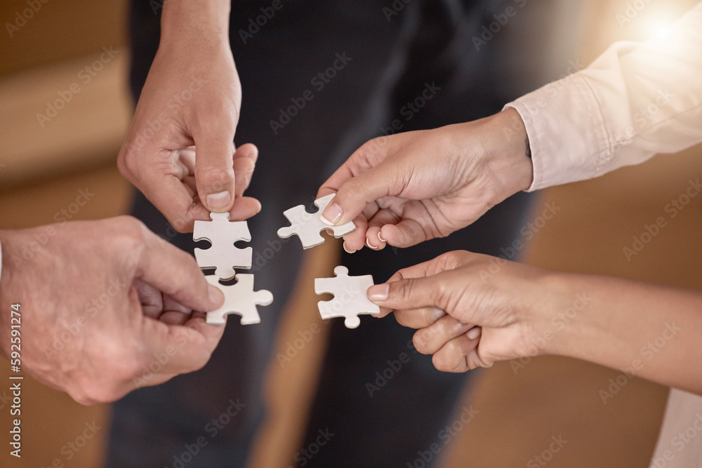 Business people, hands and puzzle piece in planning, collaboration or teamwork brainstorming at the office. Hand of group in team building, strategy or activity for engagement, support or interaction Business people, hands and puzzle piece in planning, collaboration or teamwork brainstorming at the office. Hand of group in team building, strategy or activity for engagement, support or interaction