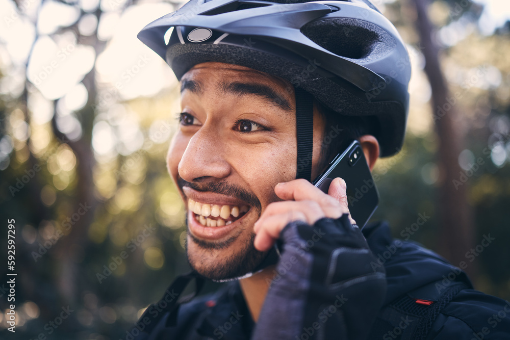 Sports, face of man and phone call outdoor for cycling, mountain bike or workout and smile in nature. Male person in forest with smartphone for communication, contact or talking fitness with helmet Sports, face of man and phone call outdoor for cycling, mountain bike or workout and smile in nature. Male person in forest with smartphone for communication, contact or talking fitness with helmet