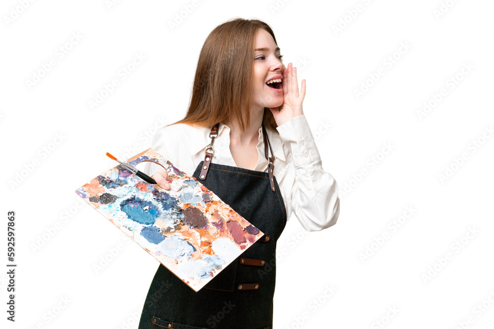 Young artist woman holding a palette over isolated chroma key background shouting with mouth wide open to the side Young artist woman holding a palette over isolated chroma key background shouting with mouth wide open to the side