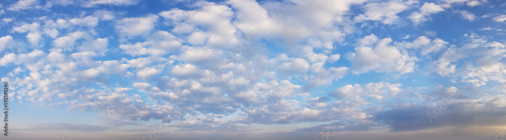 Panorama view of morning sky with fluffy white clouds Panorama view of morning sky with fluffy white clouds