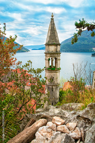 Historic city of Perast in Montenegro. Tower against the backdrop of the Bay of Kotor