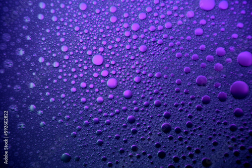 Purple soap bubbles on the water abstract light illumination For Background