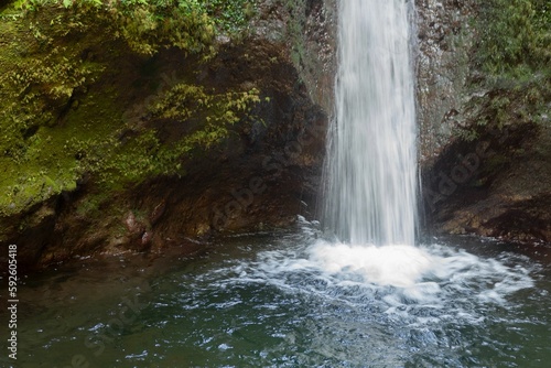 Mesmerizing Madeira Waterfalls with water flowing through rocky cliffs into a pool