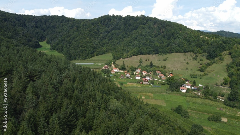 Beautiful landscape of an old Bosnian village surrounded by green mountains and rich vegetation