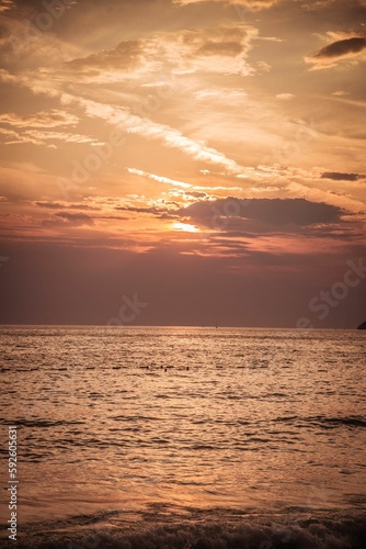 Vertical shot of a seascape in the sunset