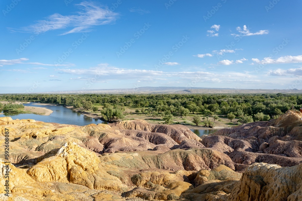 Scenic shot of the colorful and rocky beach of Xinjiang in China under the blue sky