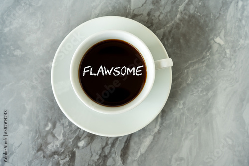 Flawsome text on cup of coffee