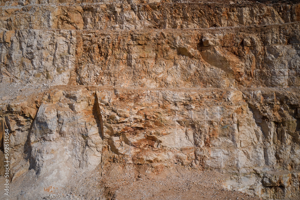 Fototapeta premium Italian marble quarries. Quarry section. Quarry wall in the mountains. marble quarries. Brown marble quarries.