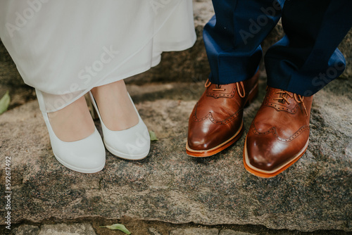 Women's and men's shoes at a wedding are photographed in close-up, soft focus photo