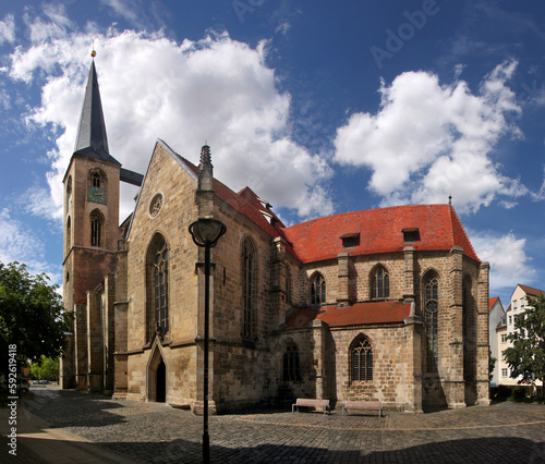 Gothic St. Martini church with bell tower and transept nave in the old town of Halberstadt, Sachsen-Anhalt in Germany photo