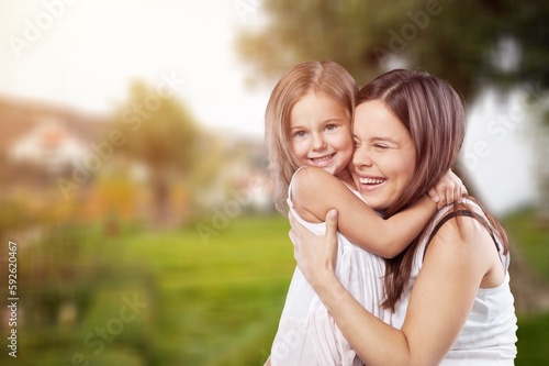 Happy young Parent and cute child with a smile