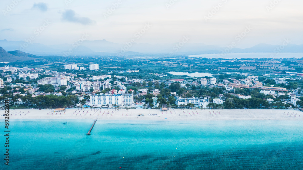 Mallorca sandy beach in Alcudia aerial view.