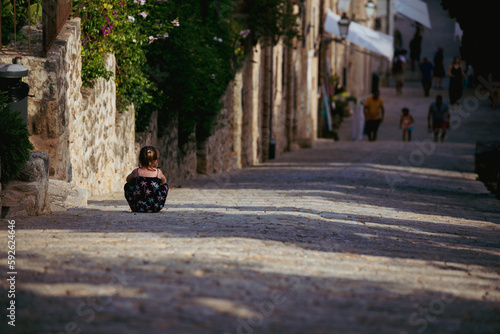 The little girl in the old ancient town. 