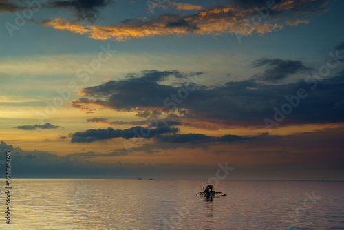 fishing at sunset © Didik