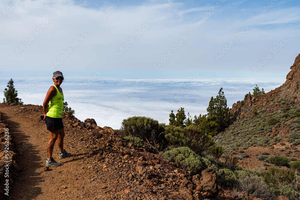 Fototapeta premium Female hiker hiking the beautiful Teide national park in Tenerife 