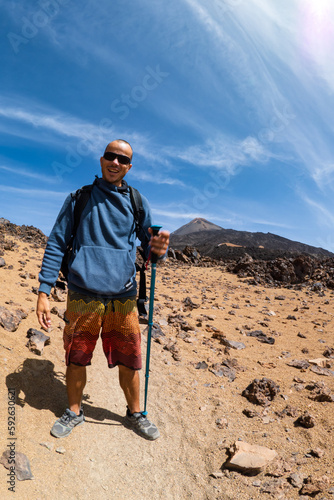Hiker hiking the Volcano of Tenerife, Mount Teide national Park