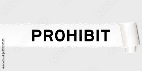 Ripped gray paper background that have word prohibit under torn part