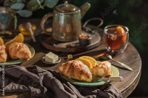 breackfast croissant and tea photo