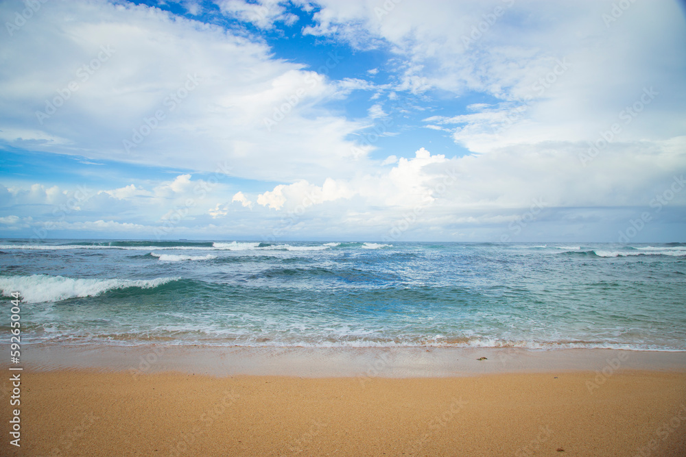 Beautiful seascape. Waves on the beach and blue sky
