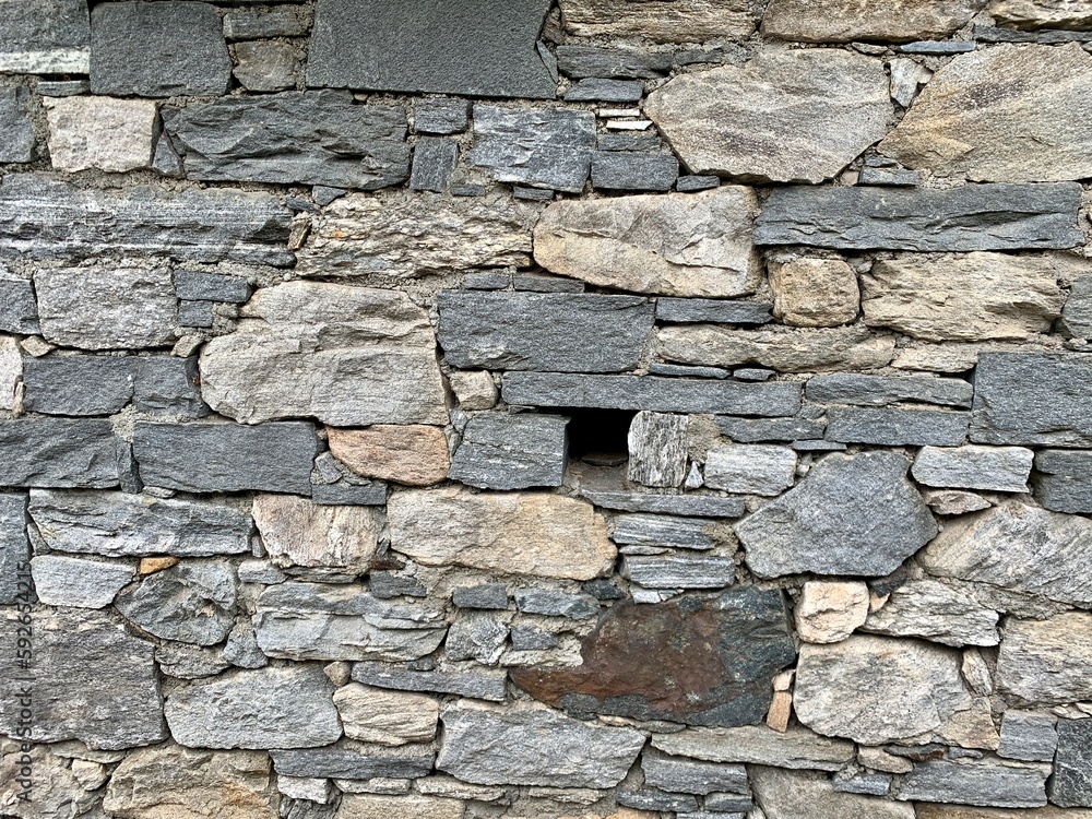 Obraz premium Mauer aus Stein / Graue Steinmauer / Natursteinmauer - / Textur / Texturen und Hintergrund