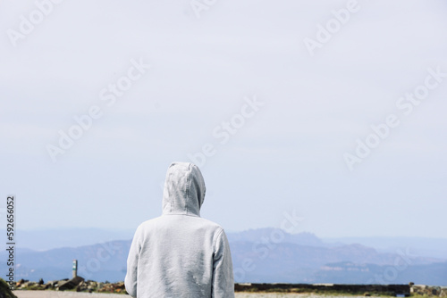 Person looking at the views from Montseny in the background of the mountains of Montserrat, Catalonia. photo