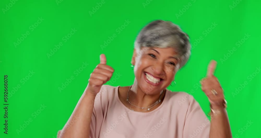 Mature woman, celebration and dance in green screen studio with excited face for win, surprise or achievement. Indian female, celebrate and wow in portrait with thumbs up for goal, winning or mock up