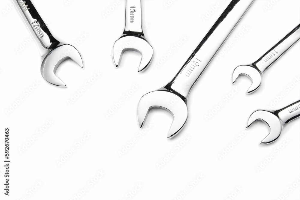 Overhead shot of five spanners on a white background Overhead shot of five spanners on a white background