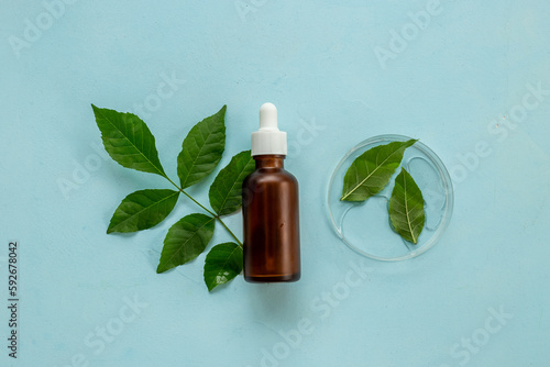 Cosmetic medical herbal essential serum oil in bottle with pipette