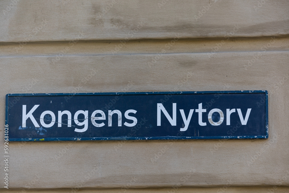 Copenhagen, Denmark A street sign for Kongens Nytorv on the side of a building, a landmark square in the center of town. Copenhagen, Denmark A street sign for Kongens Nytorv on the side of a building, a landmark square in the center of town.