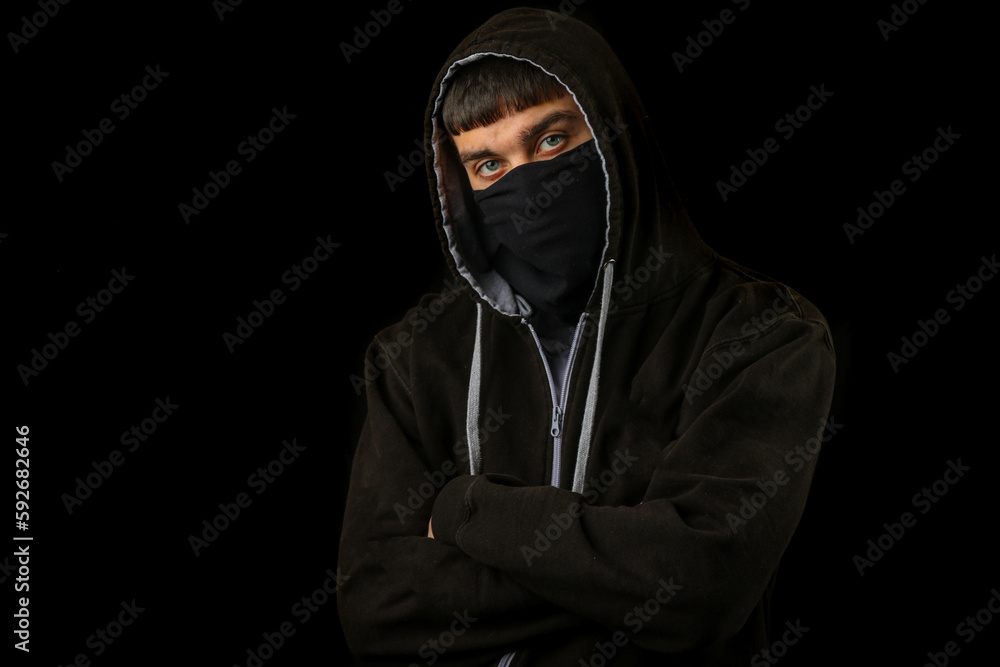 Teenage boy in a mask and hoodie Teenage boy in a mask and hoodie