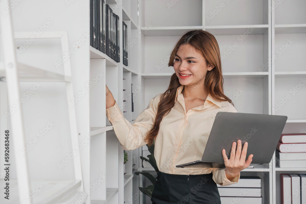 Business woman using calculator for do math finance on wooden desk in office and business working background, tax, accounting, statistics and analytic research concept.. Business woman using calculator for do math finance on wooden desk in office and business working background, tax, accounting, statistics and analytic research concept..
