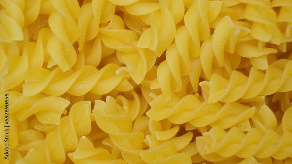 Fusilli pasta from durum wheat, in the form of spirals, whirl, top view. Fusilli pasta from durum wheat, in the form of spirals, whirl, top view.