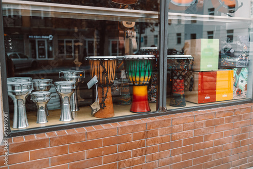 Professional musical instruments in a specialty store through the window