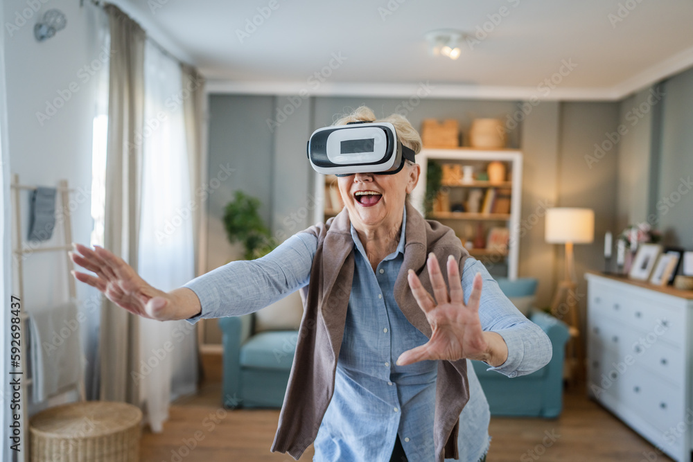 Woman mature senior female at home enjoy virtual reality VR headset Stock  Photo | Adobe Stock