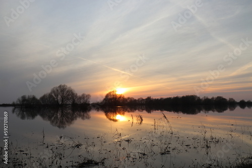 Sunset on a cloudy evening over the flood of the Staritsa River near the village of Agro-Pustyn  Ryazan Region