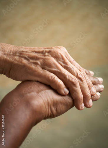 Fototapeta Naklejka Na Ścianę i Meble -  Helping hands, care for the elderly concept, close up with selective focus.