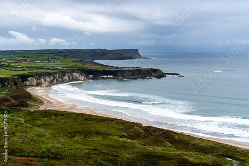 White Park Bay, Northern Ireland, United Kingdom. Whitepark Bay and three-mile long beach located near Ballycastle, County Antrim, on the north coast along the Giant’s Causeway Coastal Route. photo