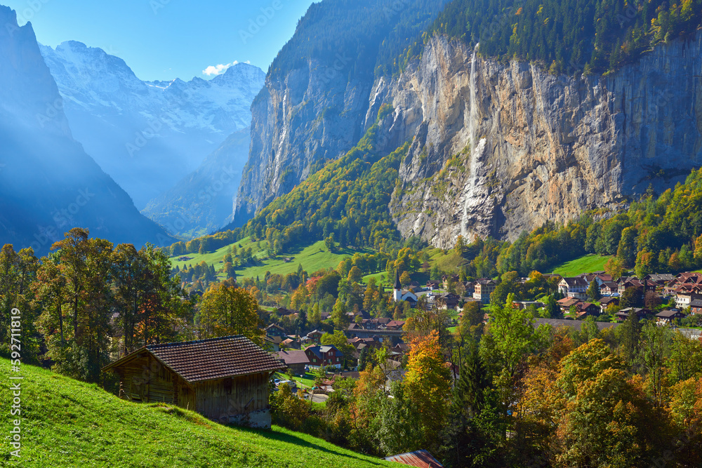Fototapeta premium Morning view of Staubbach falls and Lauterbrunnen village in Switzerland.