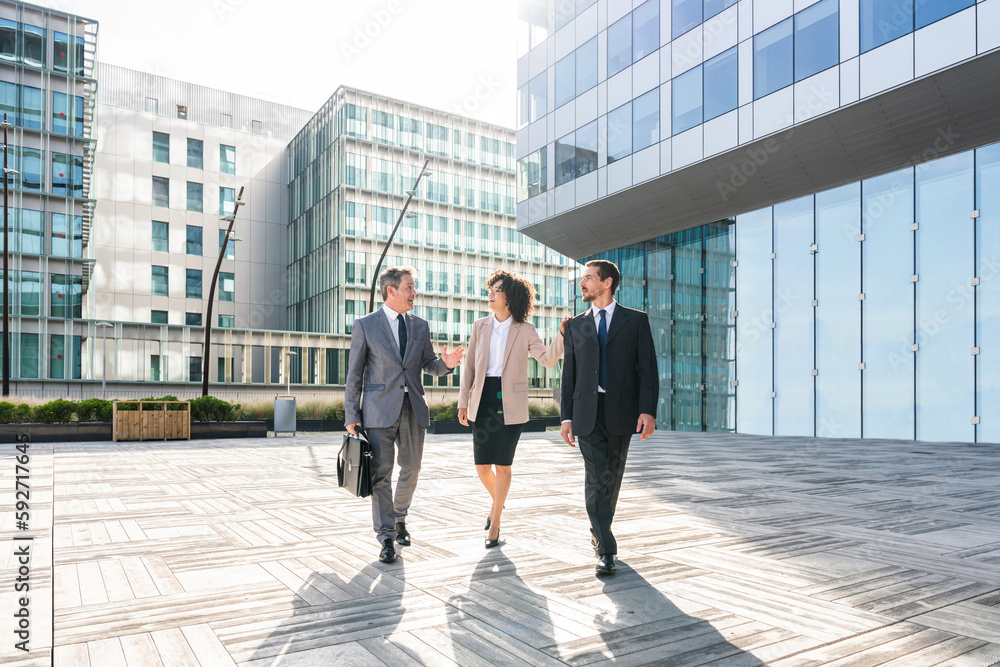 Multiethnic business people meeting in a business park - Multiracial group of corporate colleagues Multiethnic business people meeting in a business park - Multiracial group of corporate colleagues