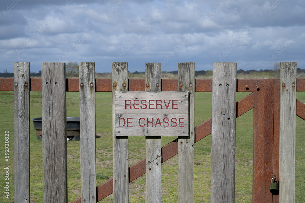 wooden barrier with inscription: hunting reserve wooden barrier with inscription: hunting reserve