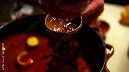 Preparation of queimada alcohol drink during San Juan holiday in Galicia, Spain photo