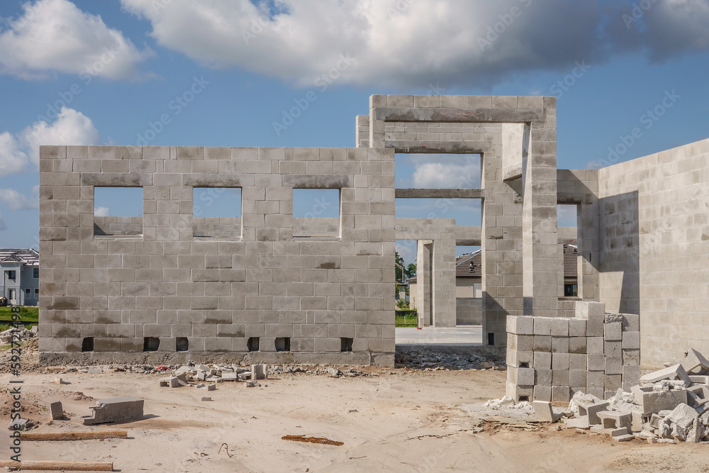 Exterior concrete walls of single-family house under construction in a suburban development in west central Florida