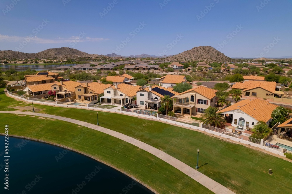 Bird's-eye view of a residential district next to a lake Bird's-eye view of a residential district next to a lake