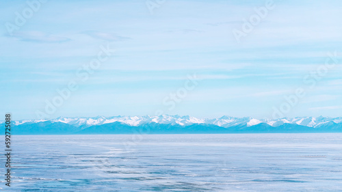 Winter landscape with mountains and Lake Baikal in Siberia on a sunny day.