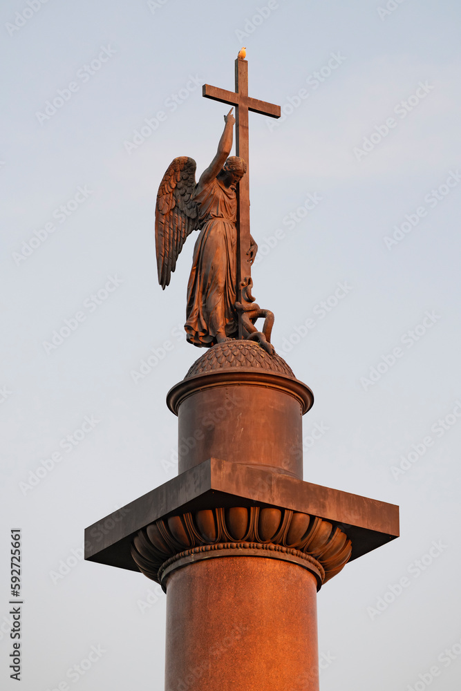 Angel on top of the Alexander Column (1834) in the light of the setting sun. Saint-Petersburg, Russia